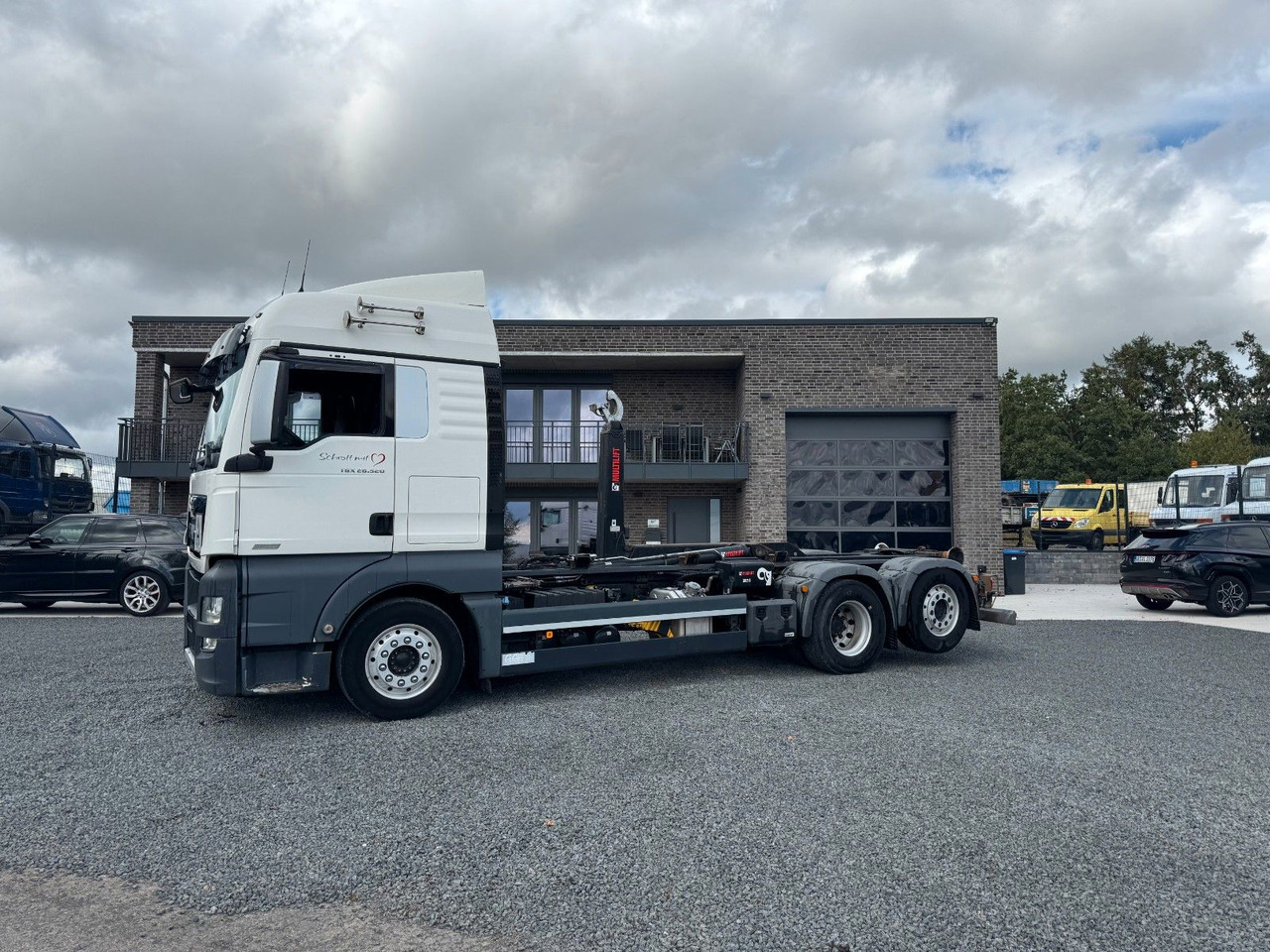 MAN TGX 26.520 D38 Abrollkipper Multilift - Hook lift truck: picture 1 MAN TGX 26.520 D38 Abrollkipper Multilift - Hook lift truck: picture 1