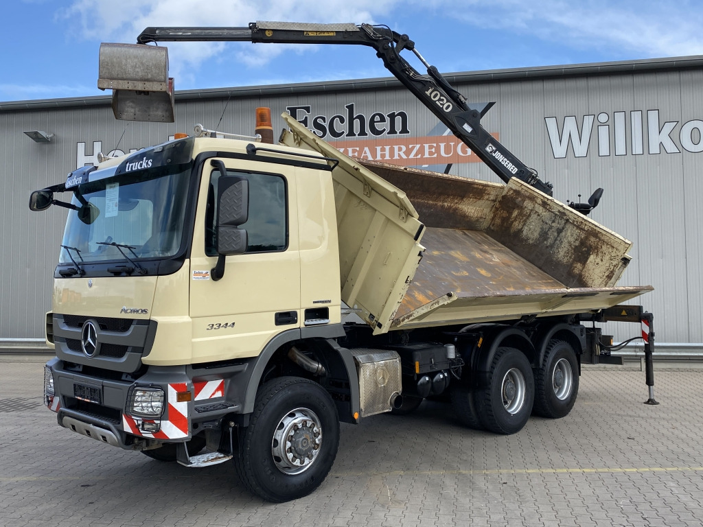 Mercedes-Benz 3344 AK 6x6 / Jonsered 1020 Kran - Tipper, Crane truck: picture 1 Mercedes-Benz 3344 AK 6x6 / Jonsered 1020 Kran - Tipper, Crane truck: picture 1