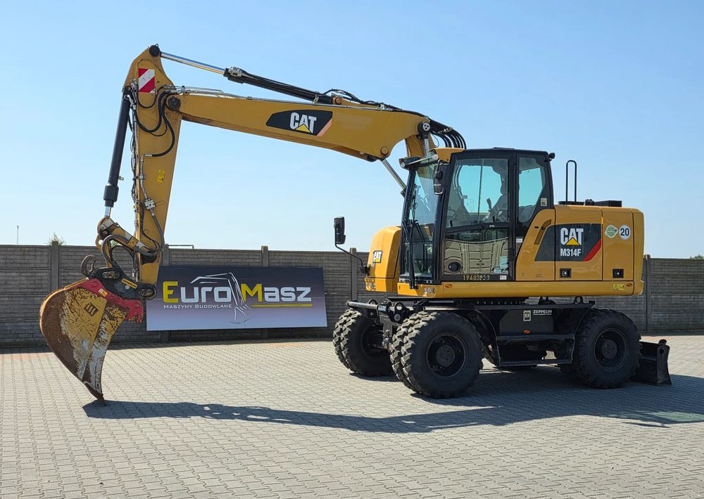 Caterpillar M314F, 2019 ROK, 3300 MTH, OIL QUICK OQ 65 - Wheel excavator: picture 1 Caterpillar M314F, 2019 ROK, 3300 MTH, OIL QUICK OQ 65 - Wheel excavator: picture 1