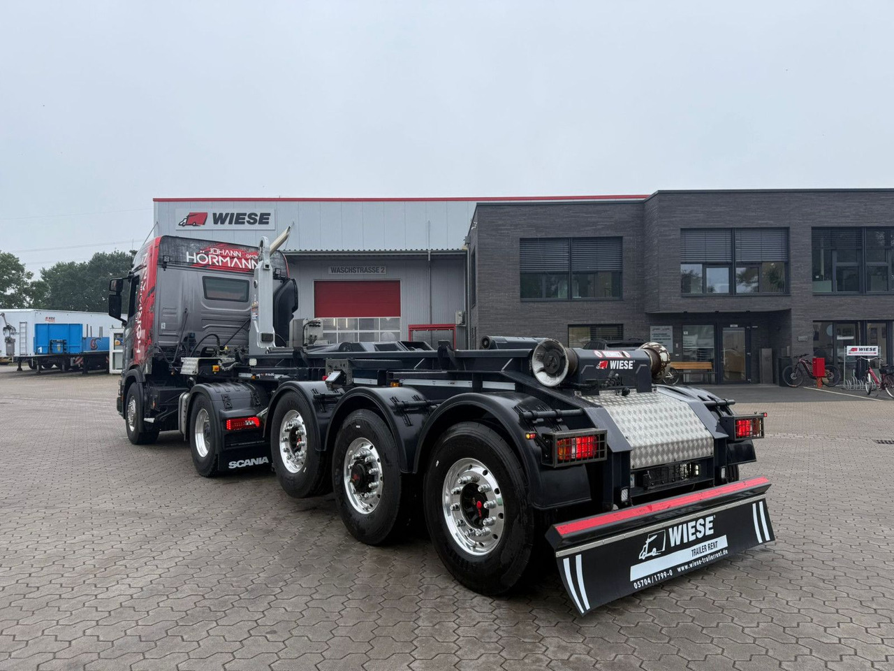 Wiese 3-Achs Abrollkipper Auflieger TRAK Achse - Container transporter/ Swap body semi-trailer: picture 1 Wiese 3-Achs Abrollkipper Auflieger TRAK Achse - Container transporter/ Swap body semi-trailer: picture 1