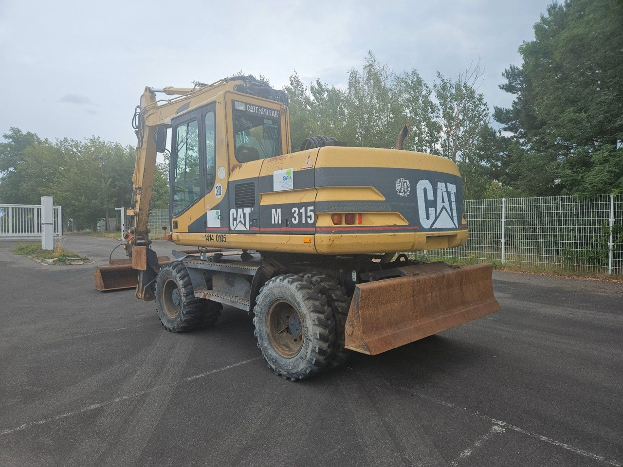 CAT M315 Mobilbagger mit Pratzen und Schild - Wheel excavator: picture 2 CAT M315 Mobilbagger mit Pratzen und Schild - Wheel excavator: picture 2