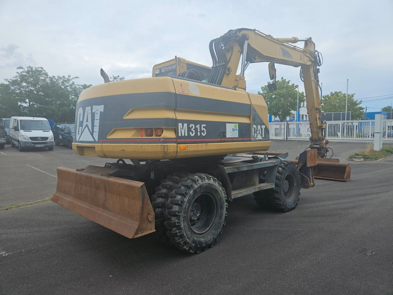 CAT M315 Mobilbagger mit Pratzen und Schild - Wheel excavator: picture 3 CAT M315 Mobilbagger mit Pratzen und Schild - Wheel excavator: picture 3