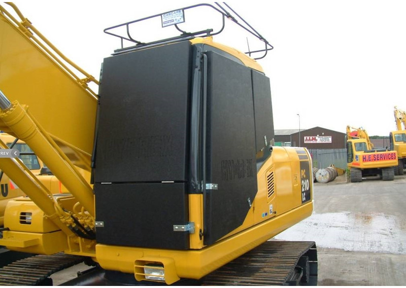 Komatsu PC210 VANDAL PROTECTION - Attachment for Construction machinery: picture 1 Komatsu PC210 VANDAL PROTECTION - Attachment for Construction machinery: picture 1