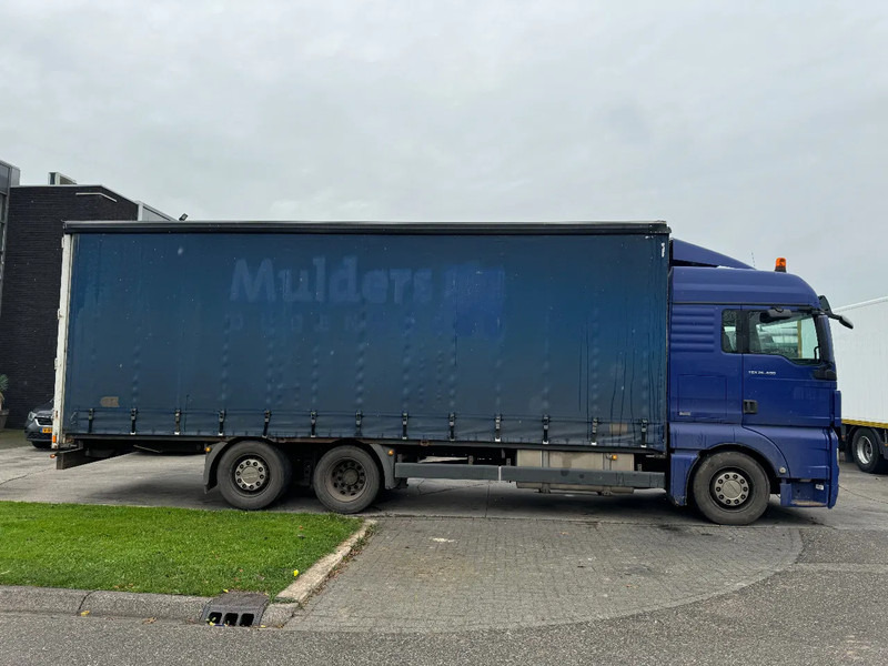 MAN TGX 26.400 6X2 - EURO 4 + LIFT + STEERING AXLE + TÜV 10-2025 - Curtainsider truck: picture 4 MAN TGX 26.400 6X2 - EURO 4 + LIFT + STEERING AXLE + TÜV 10-2025 - Curtainsider truck: picture 4